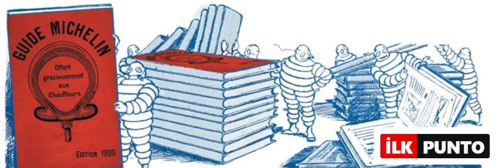 Bibendum maskotunun ilk Michelin Rehberi’nin kırmızı baskısıyla birlikte çizildiği vintage illüstrasyon; rehberin tarihini ve karakterin simgesel önemini yansıtıyor.