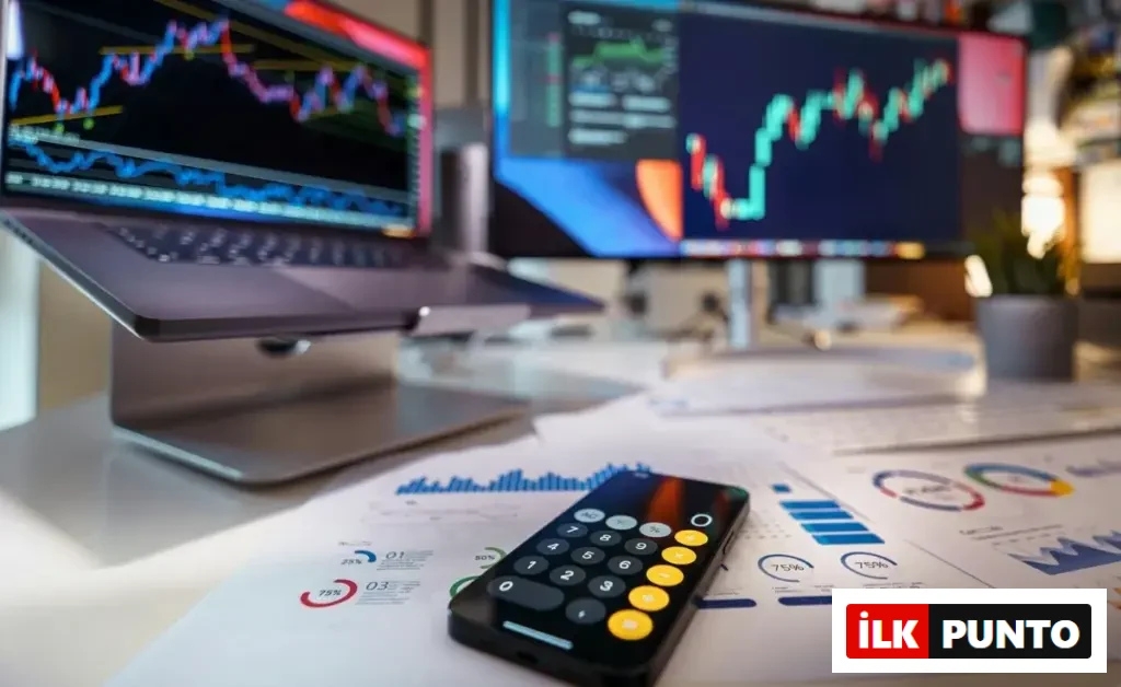 Bilgisayar ekranlarında hisse grafiklerinin yer aldığı modern ofis masasında finansal analiz ve yatırım planlaması.
